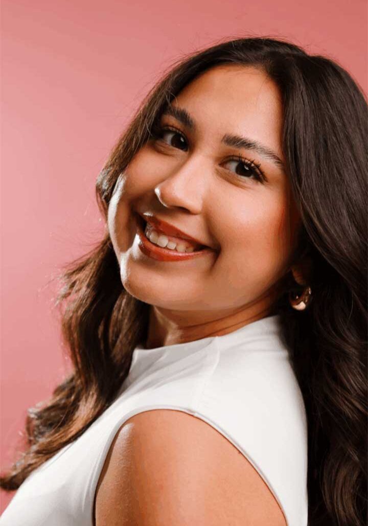 Photo of Kailyn Burts on a rose pink, solid background